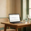 A statement of work template on a laptop in a small meeting room